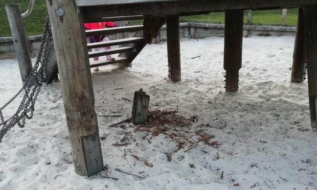 The rotten play equipment in the park