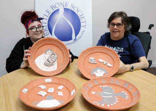 (L-r) Nicole McLaughlin and Yvonne Grant with the clay plates