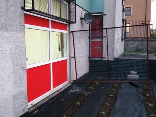 The window of the mosque, on Dens Road, was damaged