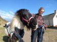 Obama the pony with Simon Mulholland at St Cyrus Nature reserve.