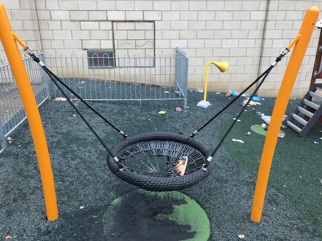 The damaged swing.