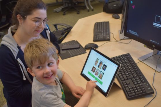 Ethical Hacking student Michaela Stewart and Matthew Prior, four, use Kidzpass