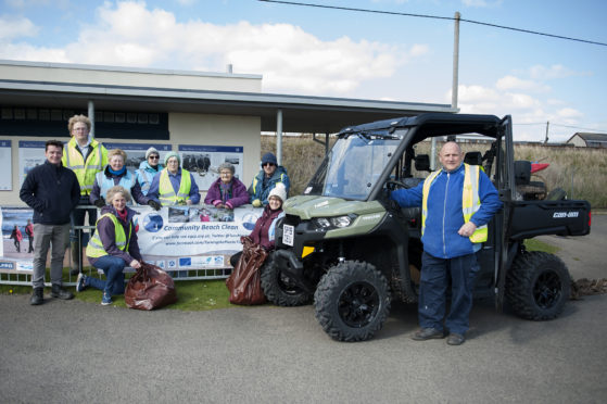 The villagers take receipt of their new vehicle