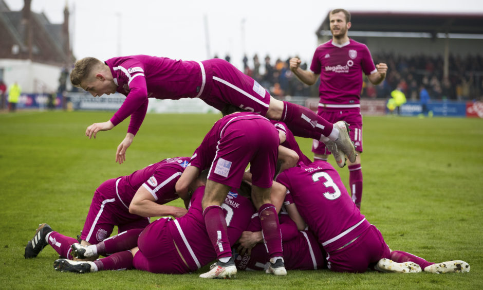 The Arbroath players celebrate Ricky Little's goal. The Arbroath players celebrate Ricky Little's goal.