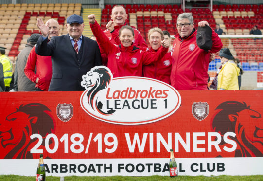 Dick Campbell and Rab Douglas are among the Arbroath staff celebrating their title win.