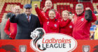 Arbroath manager Dick Campbell and his backroom staff celebrate promotion to the Ladbrokes Championship.