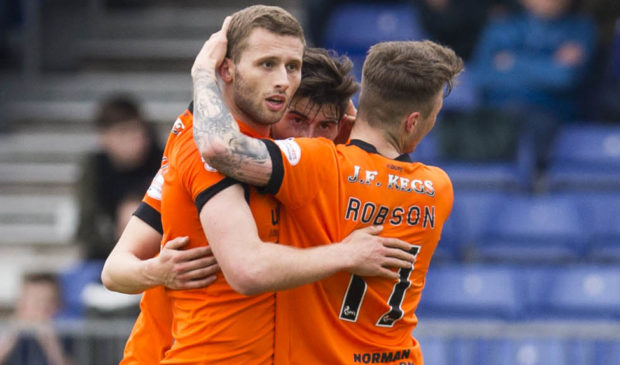 Dundee United's Pavol Safranko celebrates his goal with his teammates.