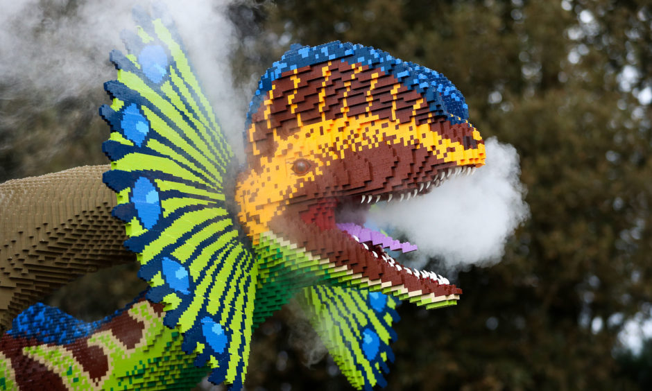Smoke comes out of the mouth of a Dilophosauru.