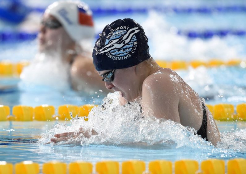 Victoria Dawson competing in Heat 2 of the Women's 200m Breaststroke.