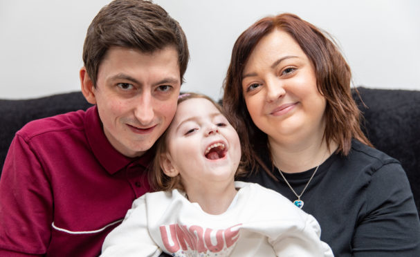 Dad Shaun McDonough, Emelia and mum Lorraine at home in Glenrothes