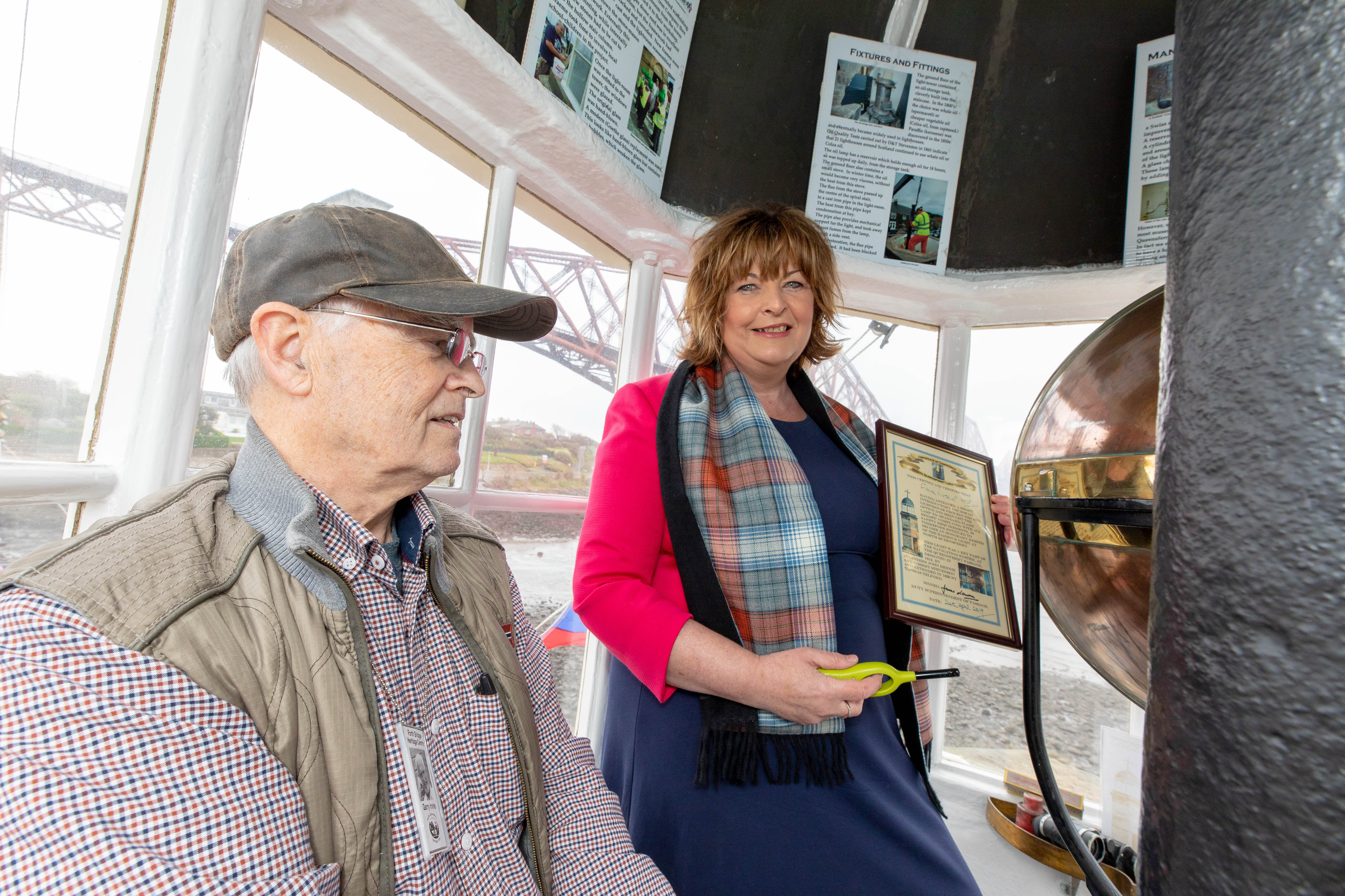Garry Irvine from North Queensferry Heritage Trust in the 1817 Light Tower with MSP Fiona Hyslop
