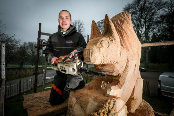 Tom Harris-Ward with the sculpture at Camperdown Park.