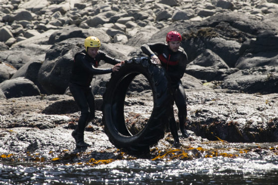 Volunteers help clean up rubbish around the coastline of the Giant's Causeway in Northern Ireland. Swimmers, jet skis and small boats all helped to reach bays at the bottom of steep cliffs close to the Unesco World Heritage Site. It was the National Trust's third litter pick at sea in the area which is teeming with wildlife from pods of dolphins to breeding seabirds, porpoises and even the occasional orca.