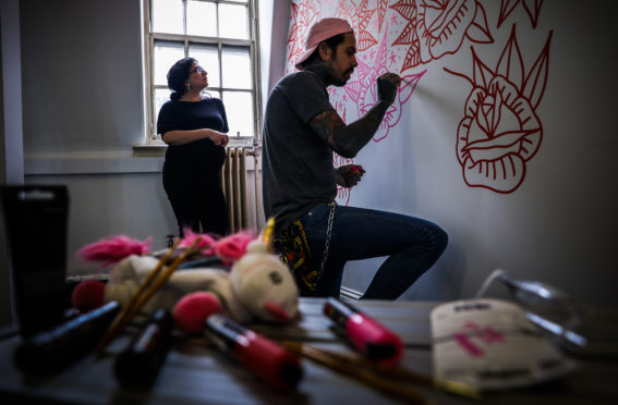 Shabana Basheer, Enterprise Manager with owner of Abandon Ship Richard Davies working on a mural at Kandahar House