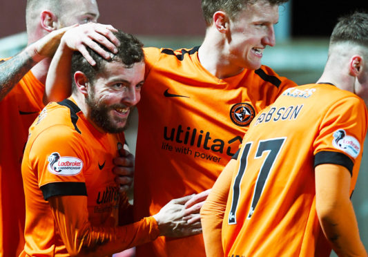 The Dundee United players celebrate Paul McMullan's weekend winner.