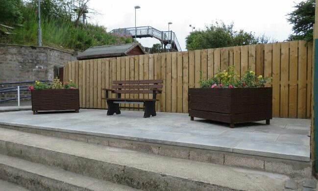 A community seating area with planters was created where the Cardenden shop once stood.