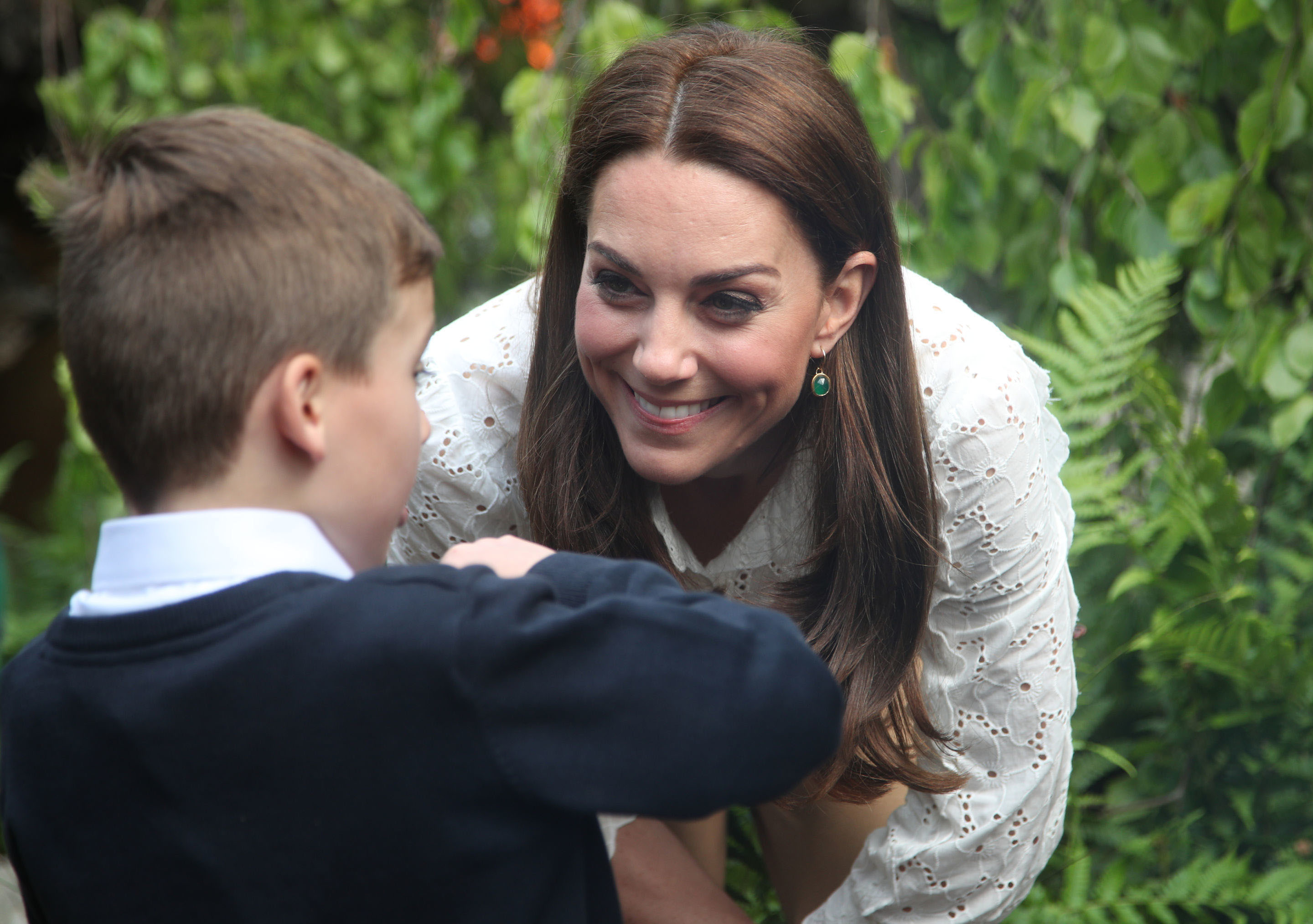 Catherine, Duchess of Cambridge speaks children during a visit to her garden at the RHS Chelsea Flower Show at the Royal Hospital Chelsea .