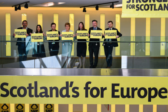 Nicola Sturgeon stands with her party's candidates for May's EU parliament elections.