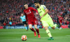 Luis Suarez of Barcelona battles for possession with Andy Robertson of Liverpool during the UEFA Champions League Semi Final second leg match between Liverpool and Barcelona at Anfield.