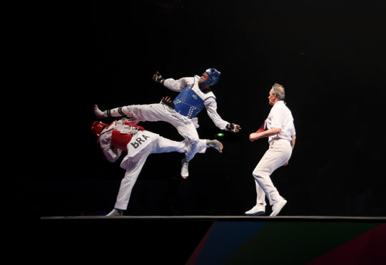 Rafael Alba of Cuba competes against of Maicon Siquera of Brazil in the Semi Final of the Mens +87kg during Day 5 of the World Taekwondo Championships at Manchester Arena .