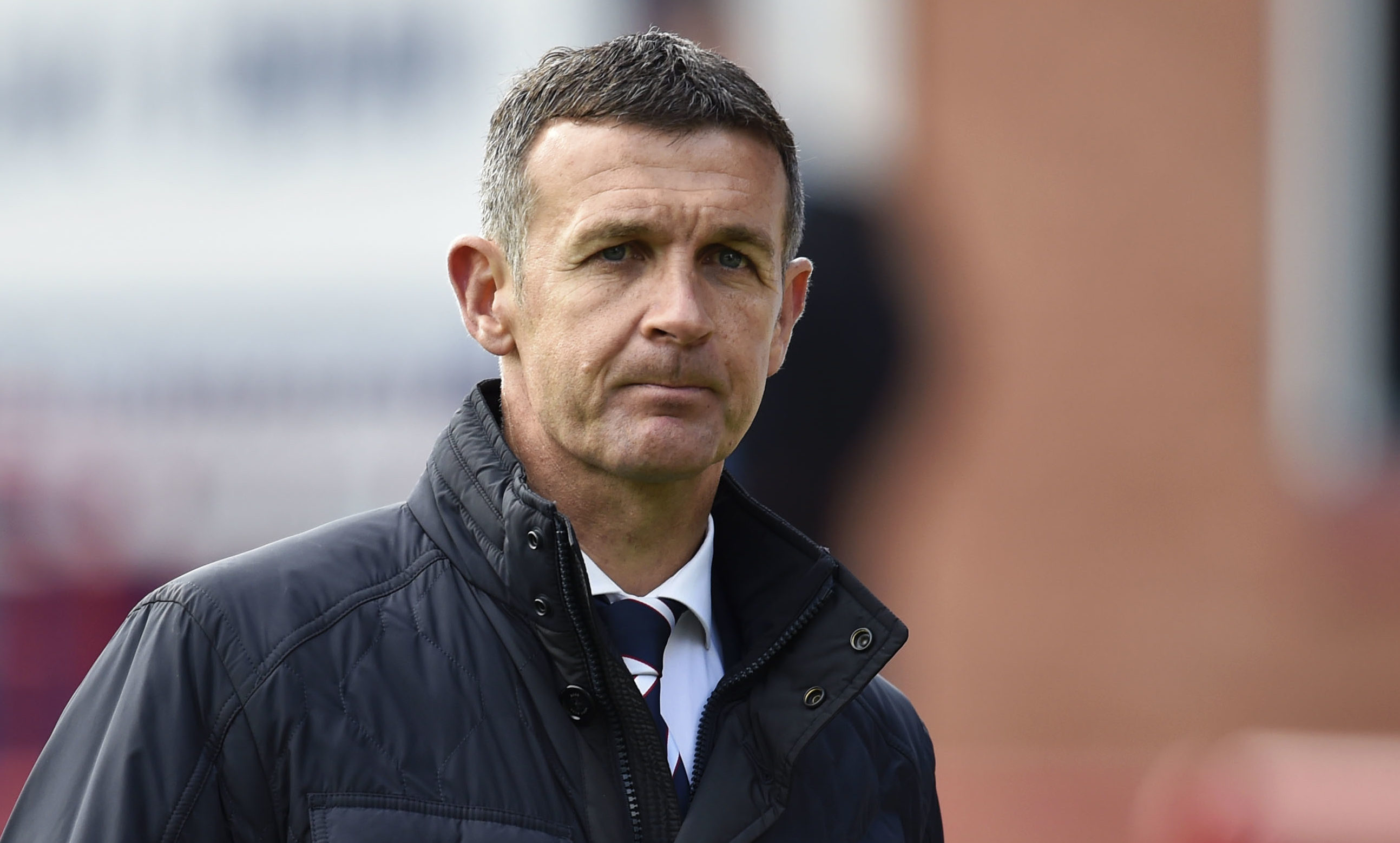 Dundee manager Jim McIntyre trudges off the field following relegation from the Ladbrokes Premiership.