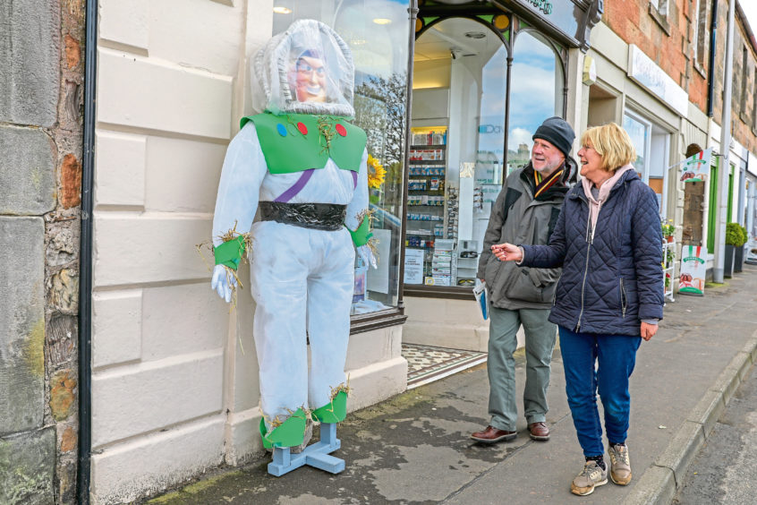 Marjory & Robin Brown from Elie have a chuckle at Buzz Lightyear.