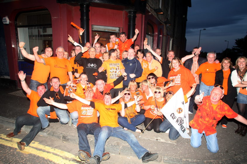 Dundee United fans celebrate Scottish Cup victory outside the Ellenbank Bar in 2010. 