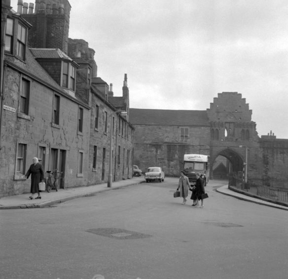 Looking towards the Abbey Port and the Gatehouse range. The last two of the houses in the foreground were to be demolished despite a fight to save them led by Councillor Frank Thornton. 1963.