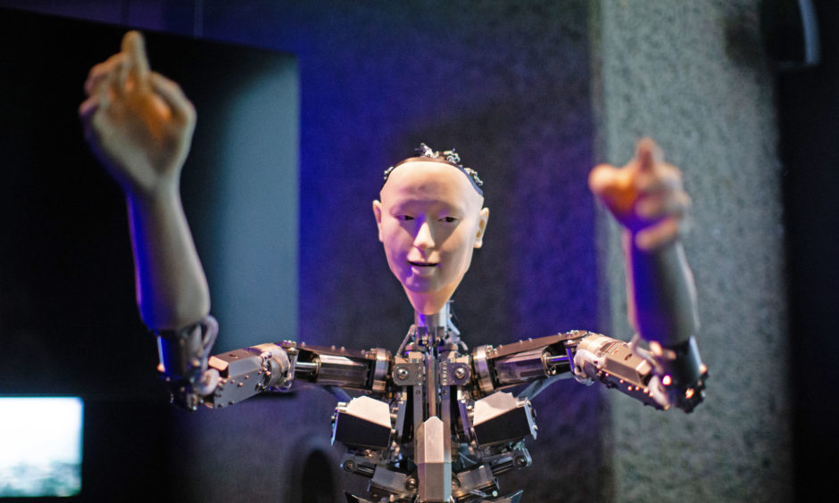 Roboticist Hiroshi Ishiguro's 'Alter', a machine body with a human like face and hands who learns through interplaying, on display.
