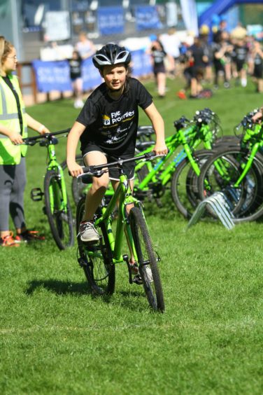 One pupil heads off on a bike.