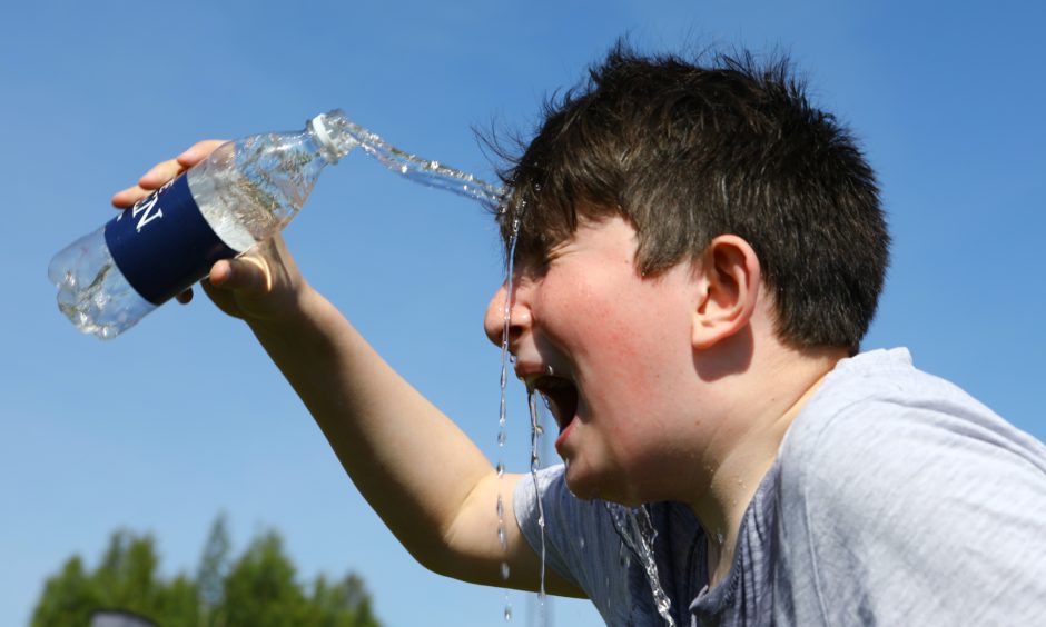 Rory White, age 11, from Dairsie Primary School, cools off.