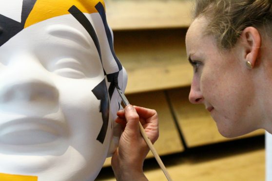 Islay Spalding painting her Oor Wullie, 'Dazzle Wullie'