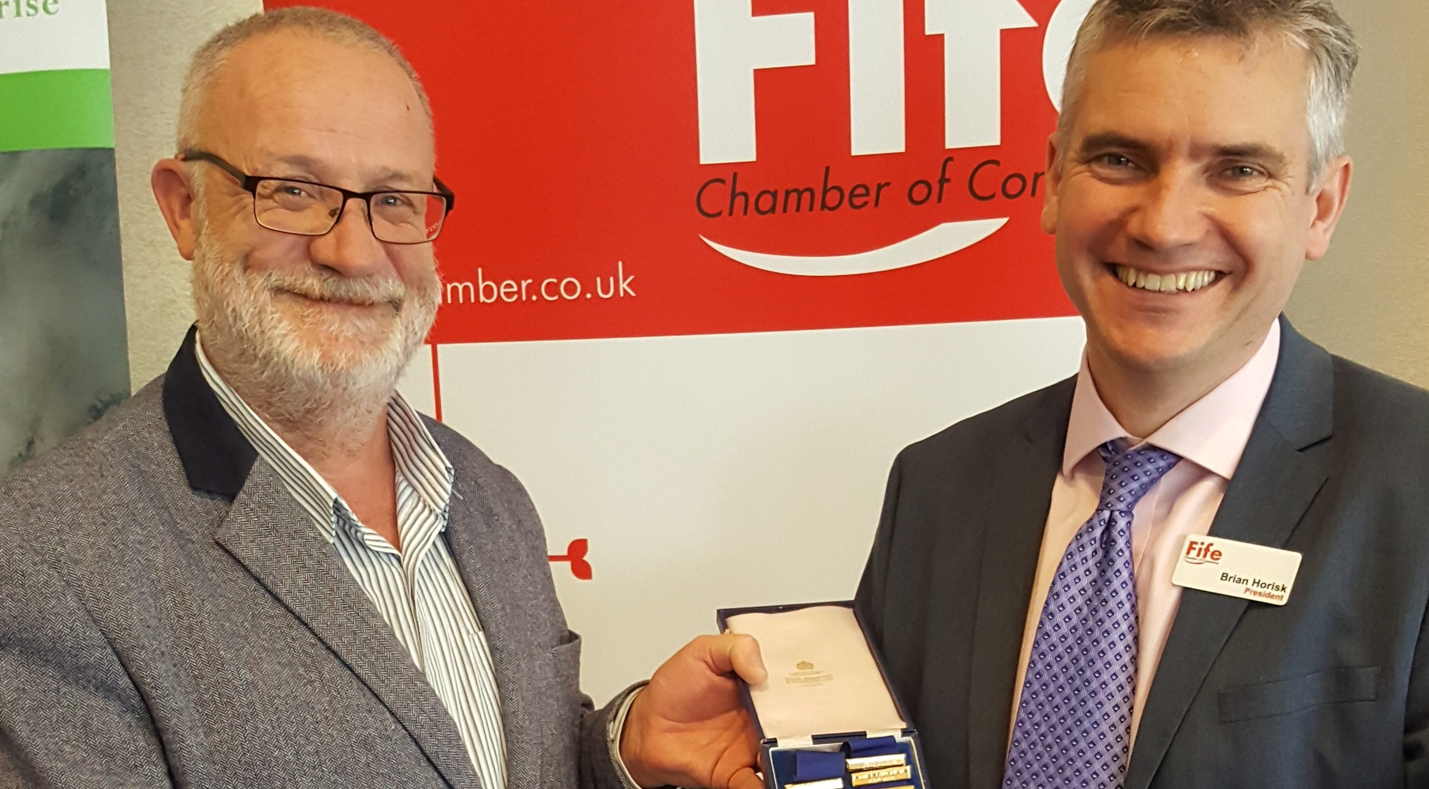 Peter Southcott congratulating Brian Horisk on his appointment to the role of President of Fife Chamber of Commerce