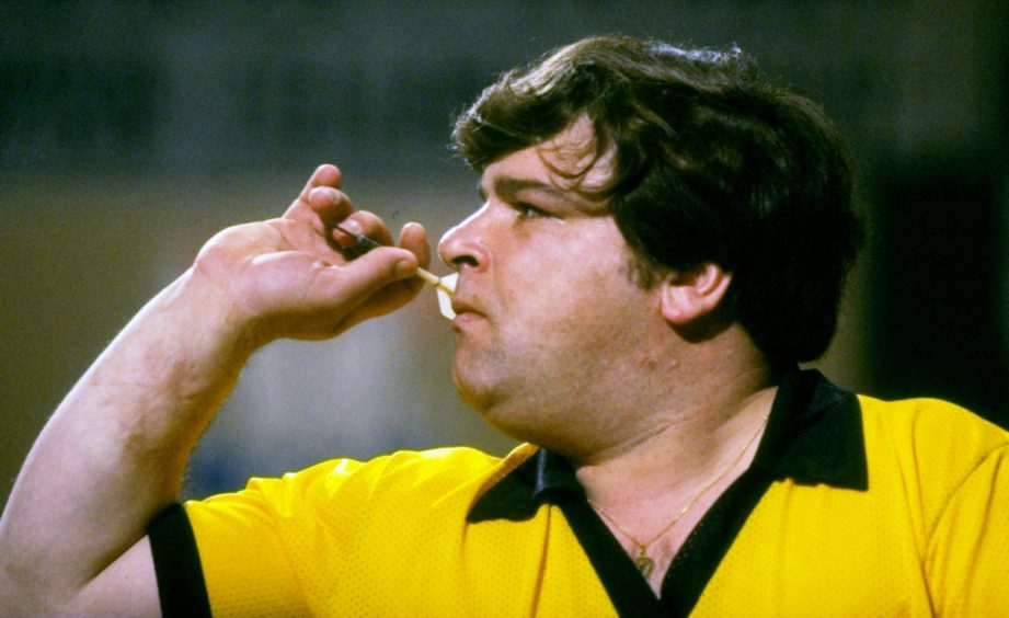 Jocky Wilson prepares to throw a dart during the 1984 British Open