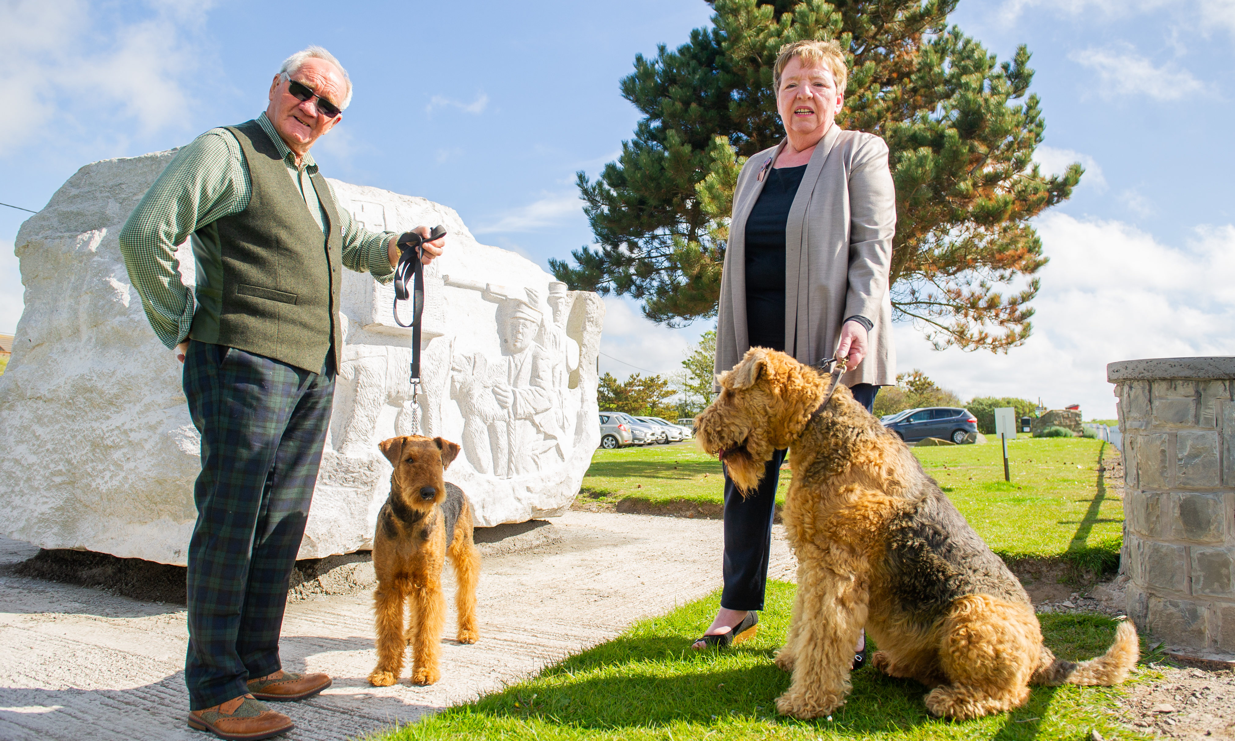 Airedale statue in East Haven. Picture Shows; l to r - Jim Collins with Penny and Wendy Turner with Cooper, East Haven Car Park, East Haven, 16th May  2019. Pic by Kim Cessford / DCT Media
