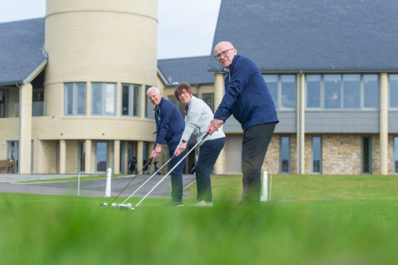 Donald Archibald, Community Benefits Administrator, Pat Sawers, Chairman of Carnoustie Golf Links and David Cheape, Community Benefits Convenor tee up the announcement
