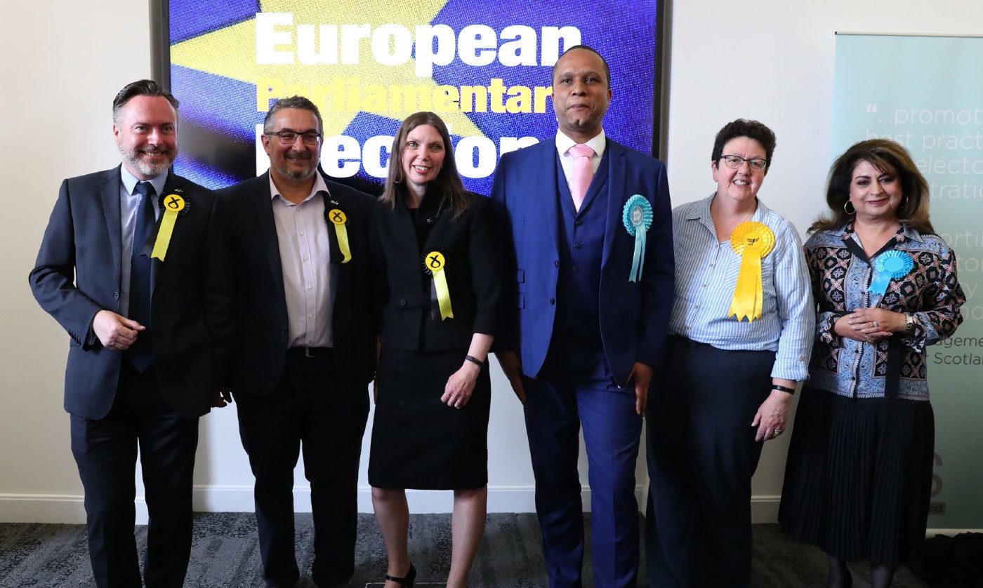 Newly elected MEPs L-r Alyn Smith, Christian Allard, Aileen McLeod, Louis Stedman-Bryce, Sheila Ritchie and Nosheena Mobarik at the European Parliamentary elections count at the City Chambers in Edinburgh.
