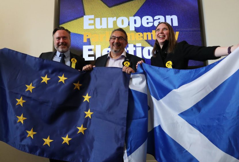 Newly elected SNP MEPs, from left, Alyn Smith, Christian Allard and Aileen McLeod at the European Parliamentary elections count at the City Chambers in Edinburgh.