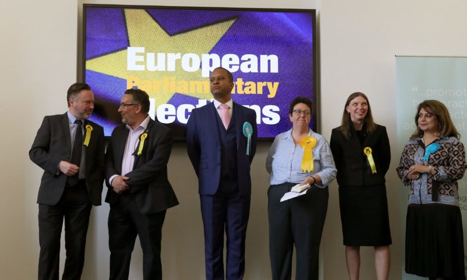Newly elected MEPs, from left, Alyn Smith, Christian Allard, Aileen McLeod, Louis Stedman-Bryce, Sheila Ritchie and Nosheena Mobarik at the European Parliamentary elections count at the City Chambers in Edinburgh.
