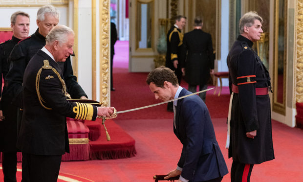 Andy Murray receives his knighthood from the Prince of Wales.