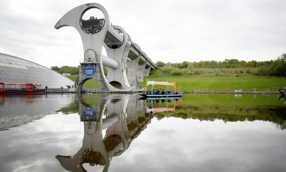 A plastic fishing boat created by environmental charity Hubbub and made of 99% recycled plastic is launched on the canal at the Falkirk Wheel. The boat will now travel around Scotland to raise awareness of pollution in the country's waters.