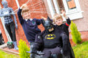 Rio Callazi, 7, and brother Chase, 2, with Batman.