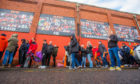 Dundee United fans queuing for play-off final tickets.