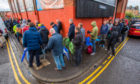 Dundee United fans queue for tickets to the play-off final.