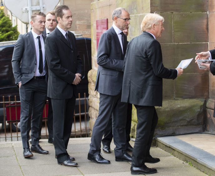 03/05/19
ST ALOYSIUS - GLASGOW
Former Celtic managers Martin O'Neill (left) and Gordon Strachan arrive at the funeral of legendary European Cup winning captain Billy McNeill