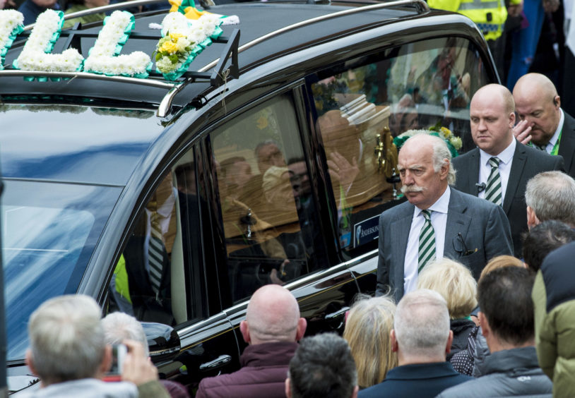 The hearse of Celtic's legendary European Cup winning captain Billy McNeill leaves St Aloysius in Glasgow following his funeral