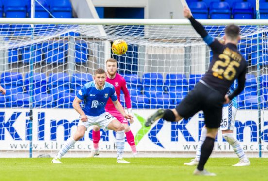 Craig Halkett's strike somehow finds its way into the net.