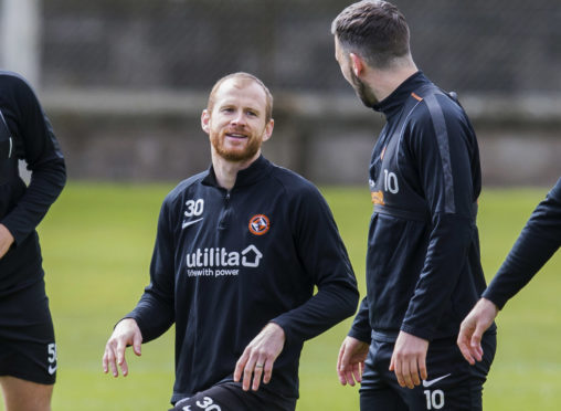 Mark Reynolds (left) shares a joke with Nicky Clark.