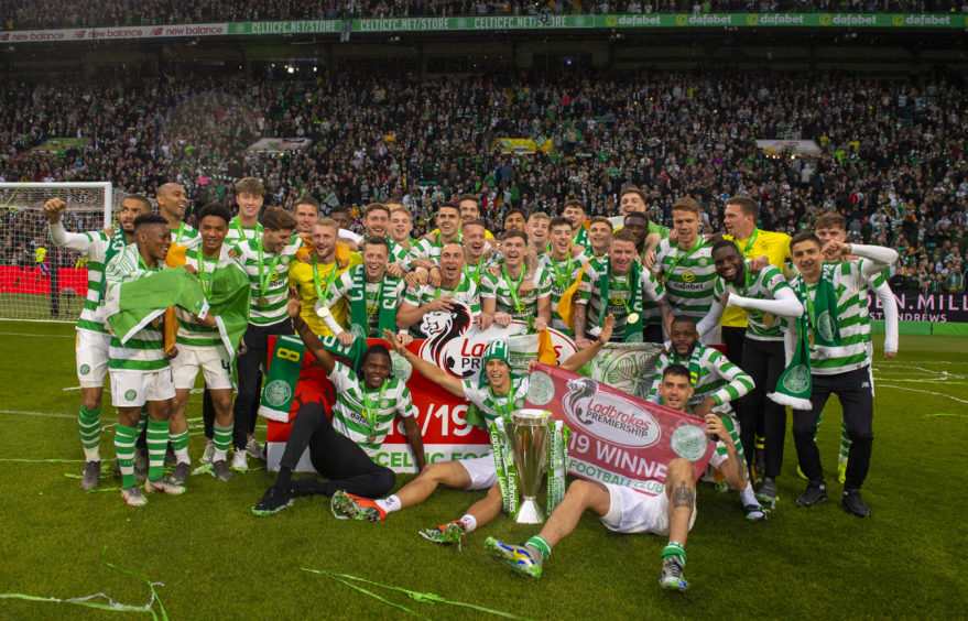Celtic's players celebrate with the Ladbrokes Premiership trophy