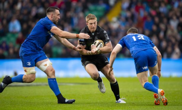 Kyle Steyn takes on Leinster's Jack Conan (left) and Garry Ringrose.